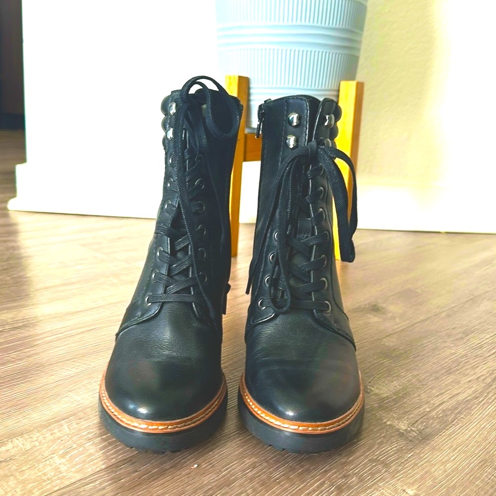 Women’s Naturalizer leather combat boots in black with heel and side zipper.